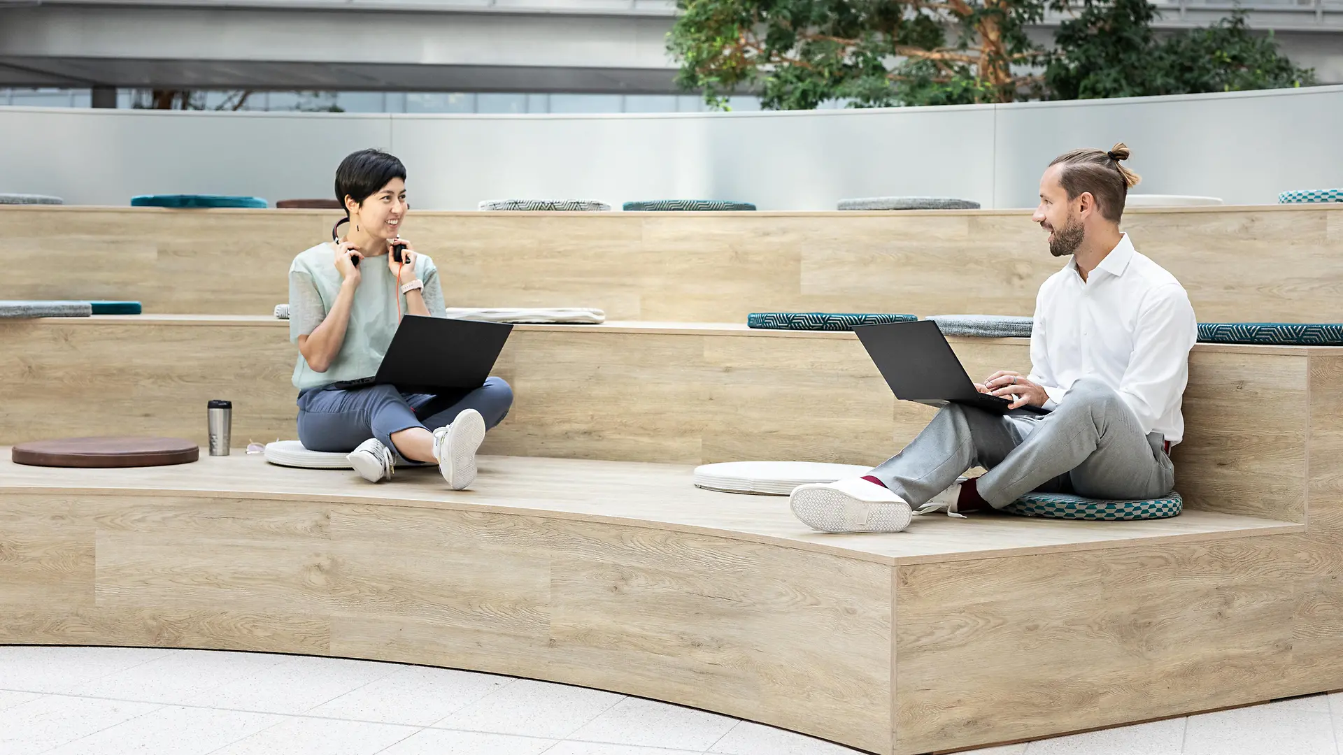 Two colleagues communicating in a modern workplace in the office.