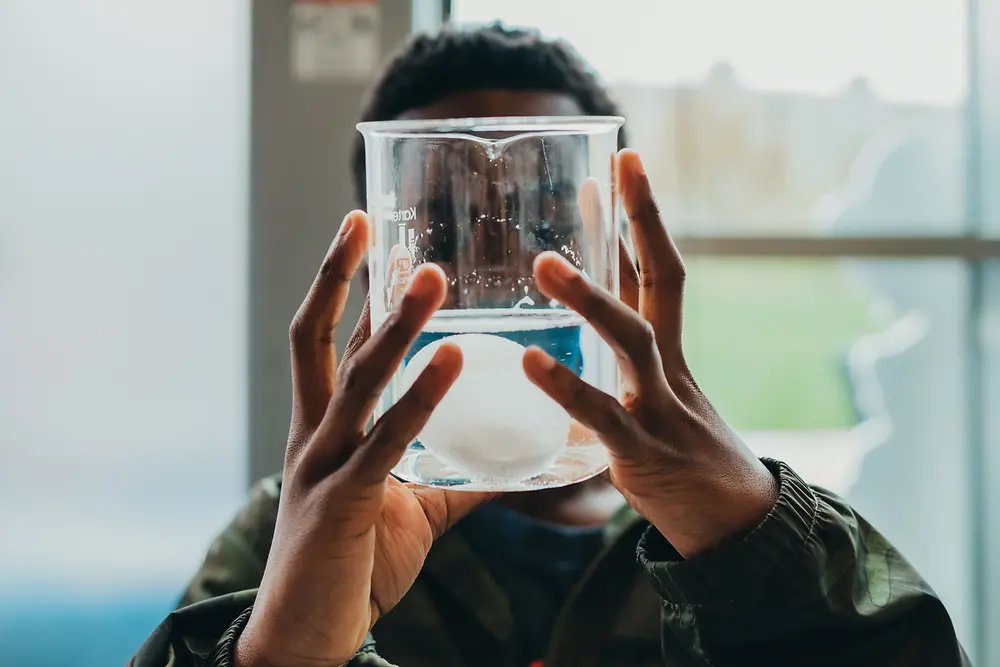 A boy experiments in a Henkel 'Forscherwelt' course in North America.