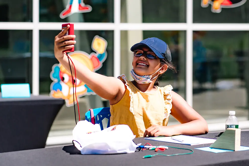 child conducting experiments at Henkel Researchers’ World