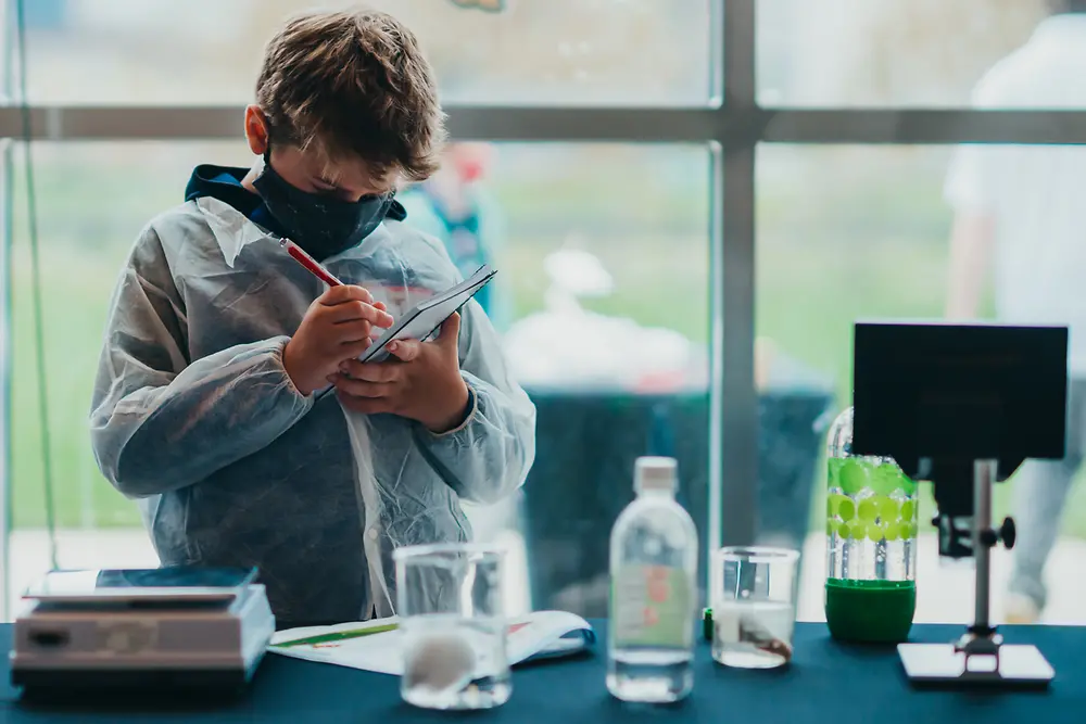 child conducting experiments at Henkel Researchers’ World