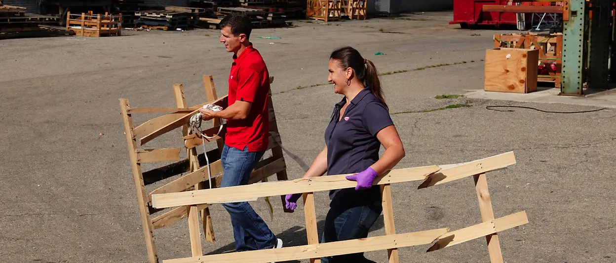 People carrying wood