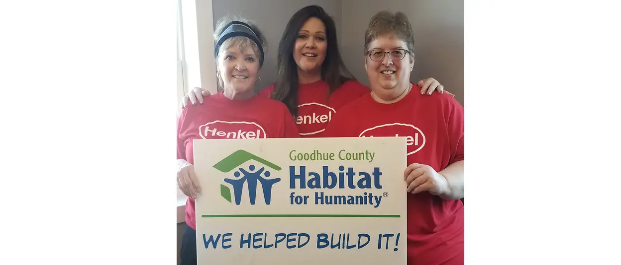 Women holding sign