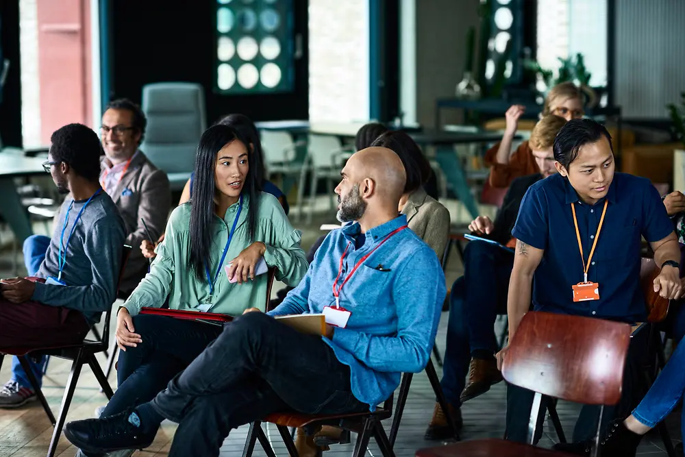 Audience attending business conference.