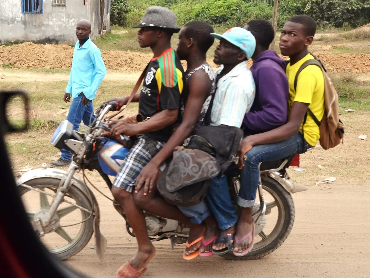 Five men on a moped.