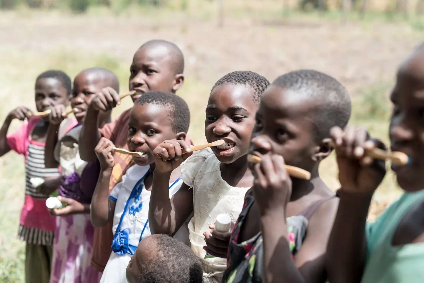 Children and their caregivers learn the right techniques for brushing their teeth